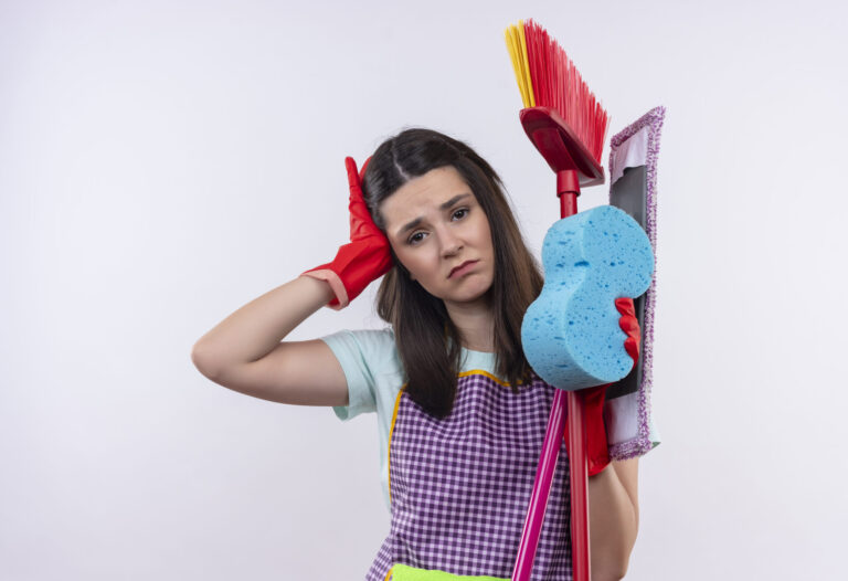 young-beautiful-girl-apron-rubber-gloves-holding-cleaning-tools-looking-tired-overworked-having-headache